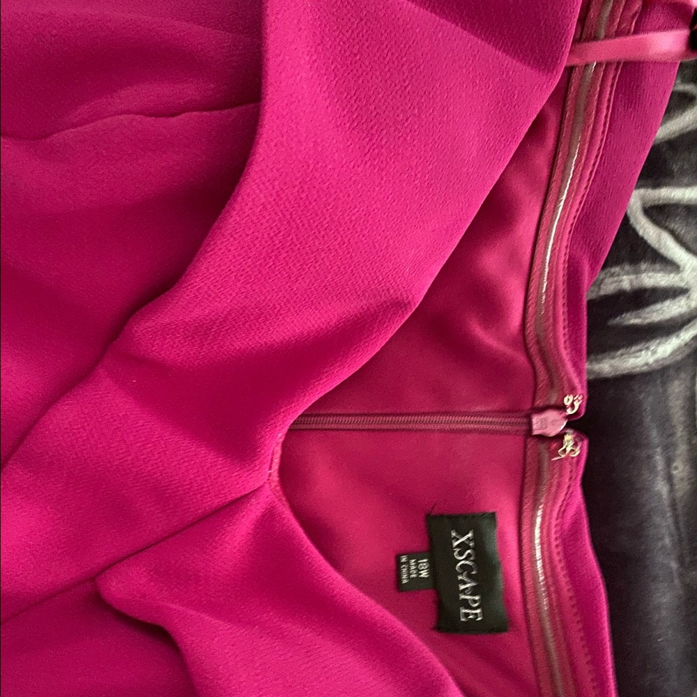 Party dress used once for a party. Color is dark pink great heavy fabric